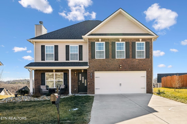 view of front facade with a garage and a front yard