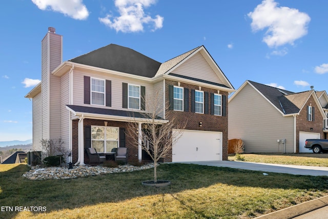 view of front of home featuring a garage and a front yard