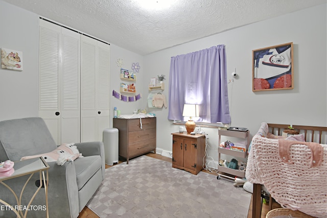 bedroom with a closet and a textured ceiling