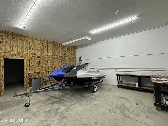 garage featuring wooden walls