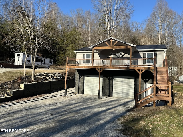 view of front of house featuring a wooden deck and a garage