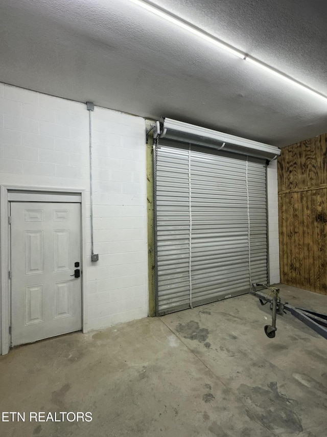 garage with wood walls