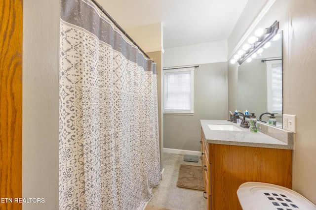 bathroom with vanity and curtained shower