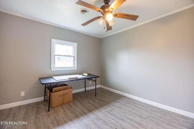 office featuring wood-type flooring, ornamental molding, and ceiling fan