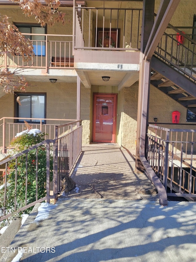 doorway to property featuring a balcony