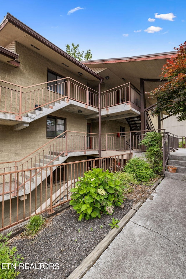 221 Woodland Rd Unit 210, Gatlinburg, TN 37738 - exterior space featuring stairway and stucco siding