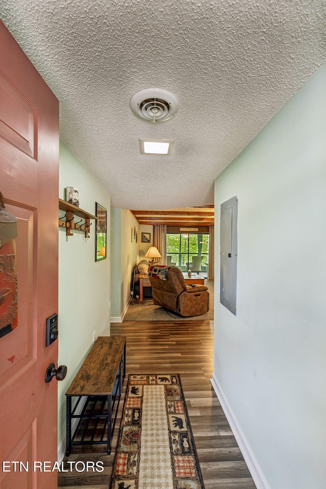 221 Woodland Rd Unit 210, Gatlinburg, TN 37738 - hallway with electric panel, wood finished floors, a textured ceiling, and baseboards