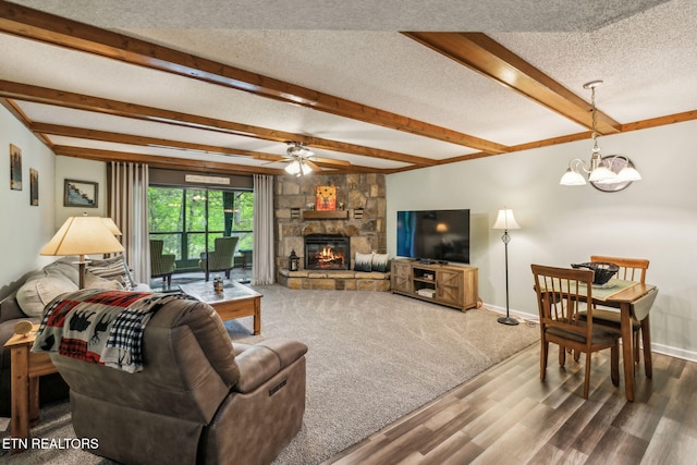 221 Woodland Rd Unit 210, Gatlinburg, TN 37738 - living area with a textured ceiling, a ceiling fan, wood finished floors, beam ceiling, and a chandelier