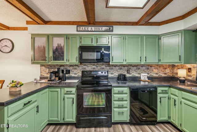 221 Woodland Rd Unit 210, Gatlinburg, TN 37738 - kitchen featuring black appliances, beam ceiling, light wood-style flooring, backsplash, and a peninsula