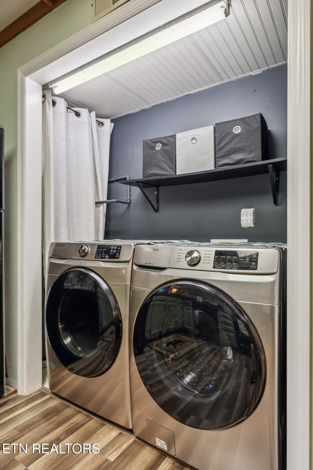 221 Woodland Rd Unit 210, Gatlinburg, TN 37738 - laundry room with washer and dryer and wood finished floors