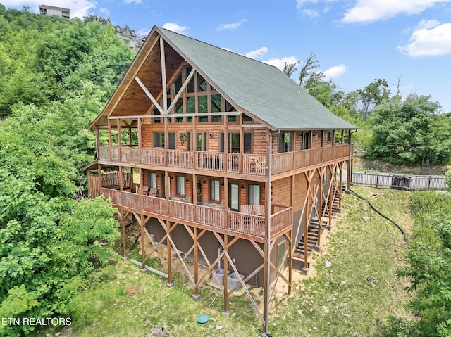 back of house featuring a deck