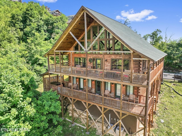 back of house featuring a deck