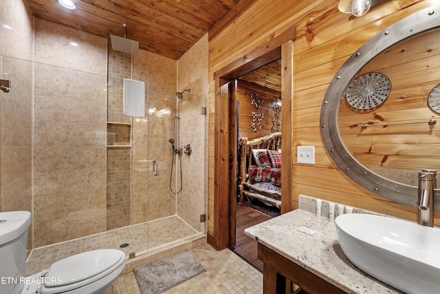 bathroom with toilet, walk in shower, wooden ceiling, and wooden walls