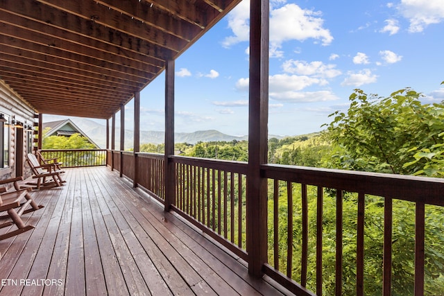 wooden terrace with a mountain view