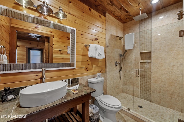 bathroom featuring sink, wood walls, a shower with shower door, and wood ceiling