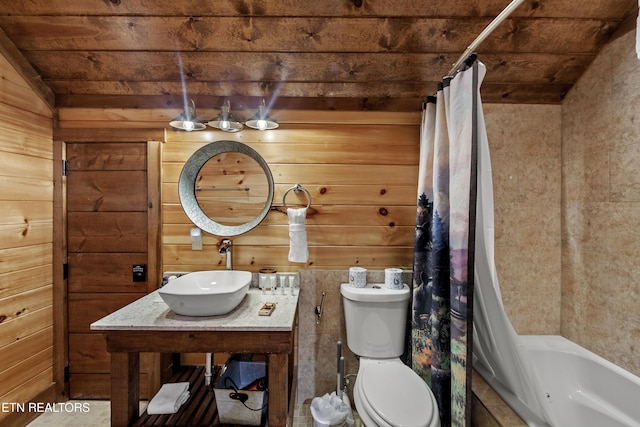 full bathroom with wooden ceiling, sink, and wooden walls