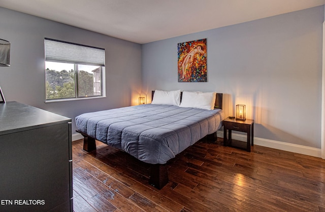 bedroom featuring dark hardwood / wood-style flooring