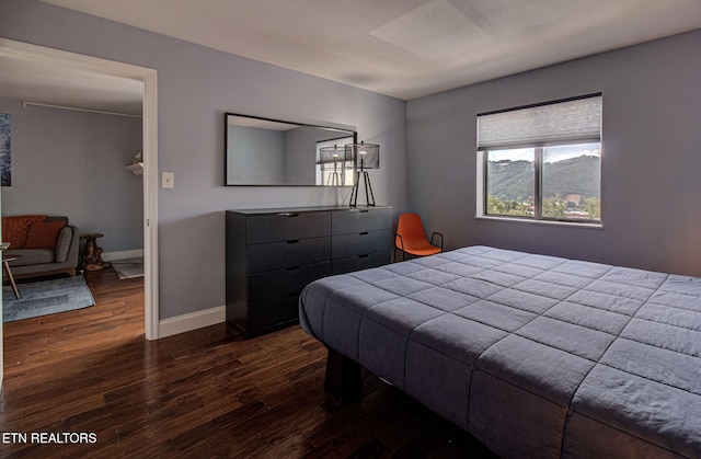 bedroom featuring dark hardwood / wood-style floors