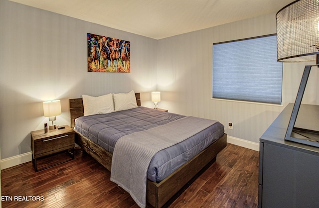 bedroom with dark wood-type flooring