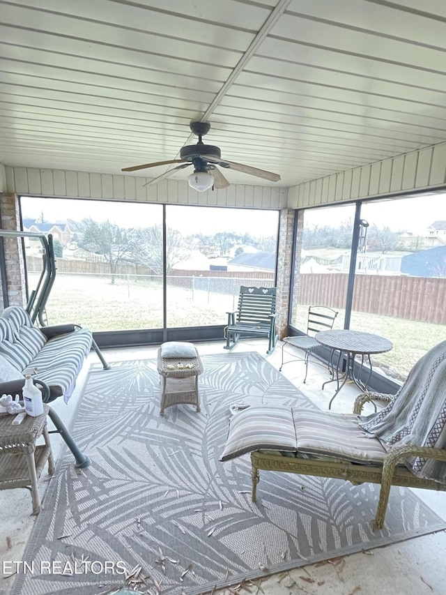 sunroom / solarium with ceiling fan