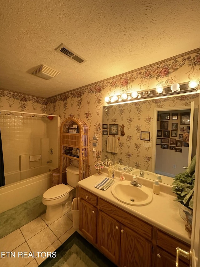 full bathroom featuring shower / bathtub combination, vanity, toilet, tile patterned floors, and a textured ceiling