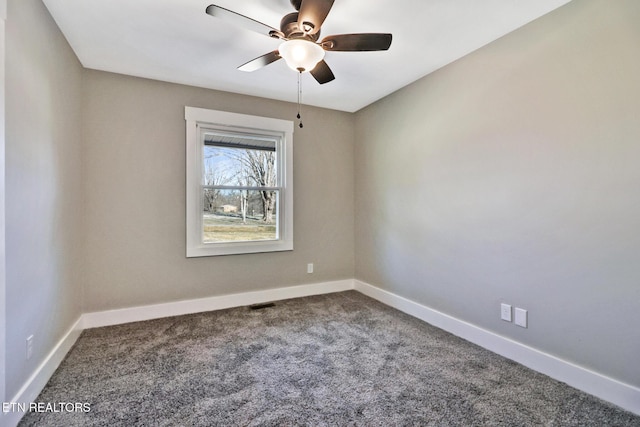 spare room with carpet floors and ceiling fan