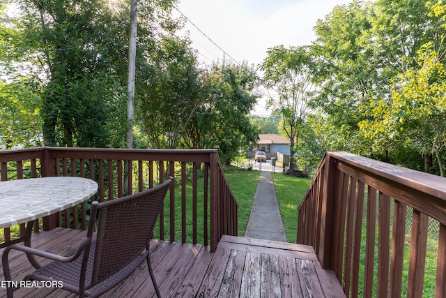 wooden deck with a yard