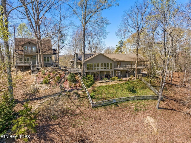 rear view of house with a deck