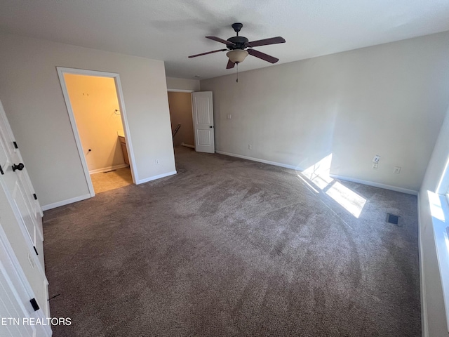 unfurnished bedroom featuring ensuite bathroom, ceiling fan, and carpet