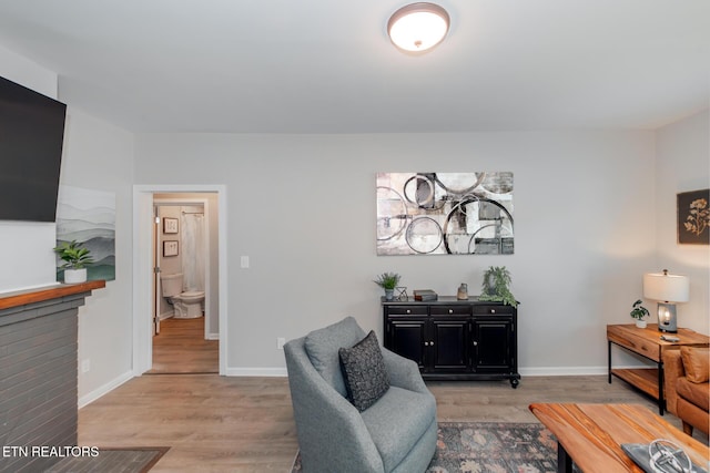 sitting room featuring light hardwood / wood-style floors