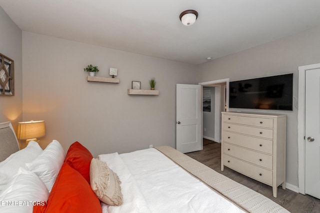 bedroom featuring dark hardwood / wood-style floors