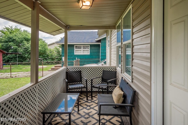 balcony featuring covered porch