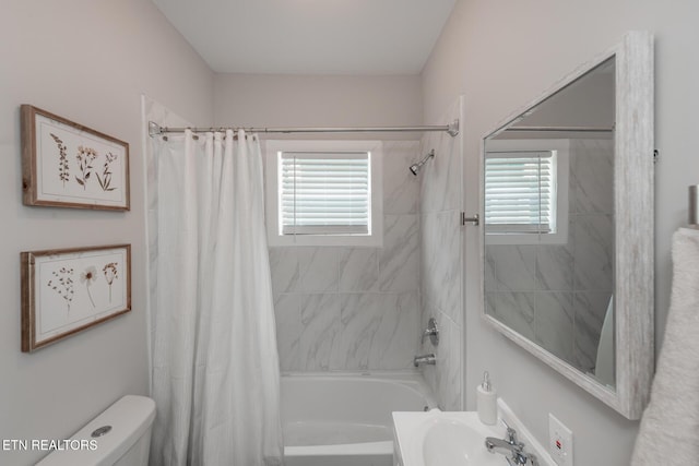 full bathroom featuring plenty of natural light, sink, shower / tub combo with curtain, and toilet