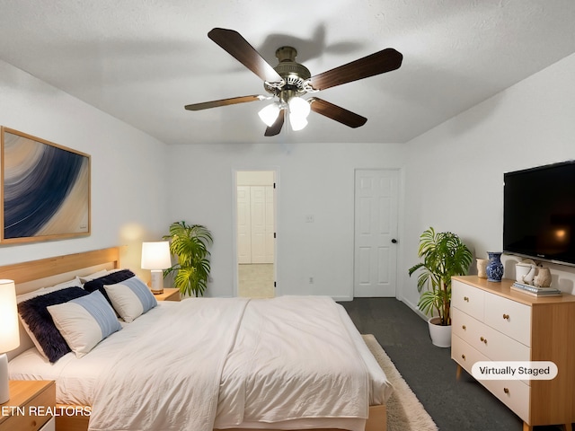 carpeted bedroom featuring ceiling fan