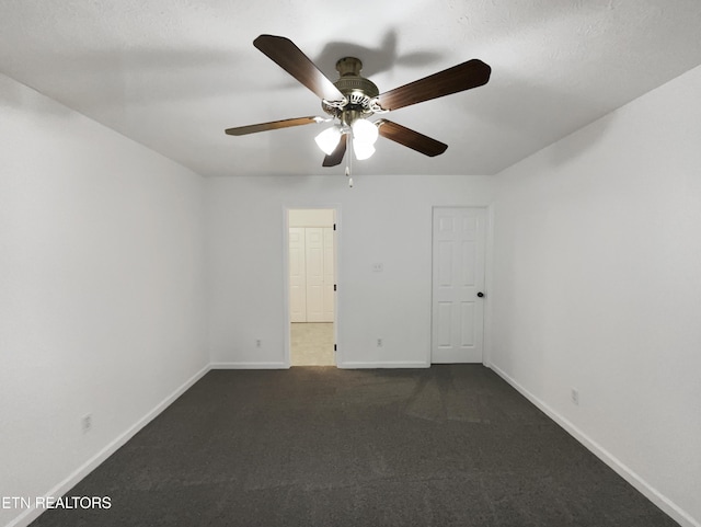 spare room with ceiling fan