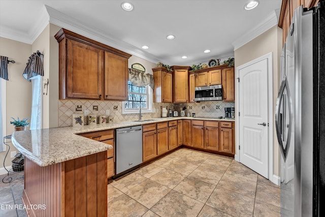 kitchen with backsplash, ornamental molding, light stone counters, kitchen peninsula, and stainless steel appliances