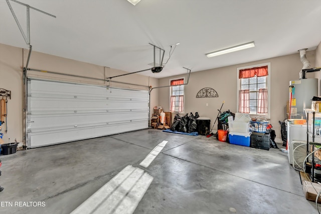 garage with a garage door opener and gas water heater