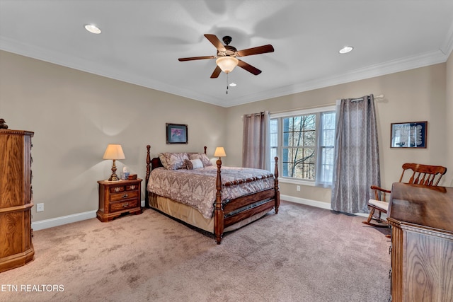 bedroom featuring crown molding, light colored carpet, and ceiling fan