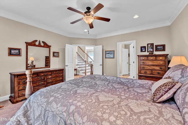 carpeted bedroom with crown molding and ceiling fan