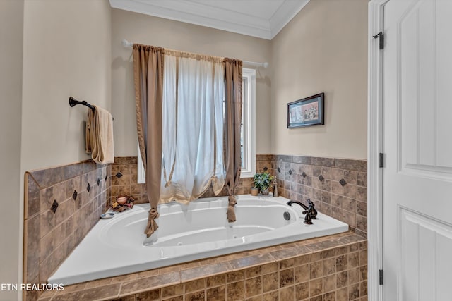 bathroom with crown molding and a relaxing tiled tub