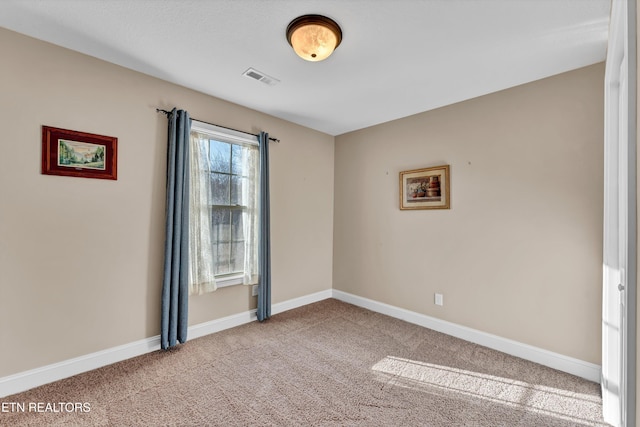 view of carpeted spare room