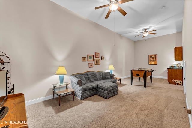 carpeted living room with ceiling fan