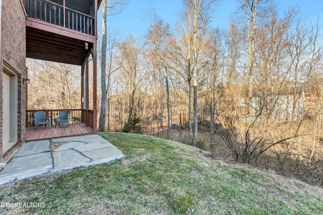 view of yard with a wooden deck