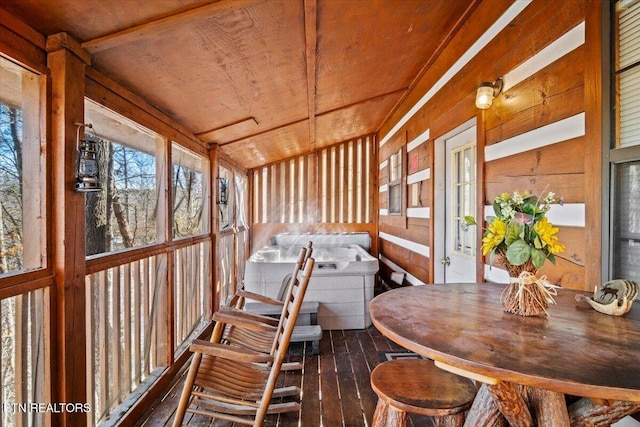 sunroom / solarium featuring wooden ceiling