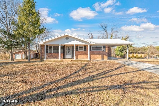 single story home with a carport and covered porch