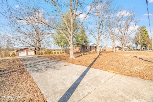 ranch-style home with an outbuilding and a garage