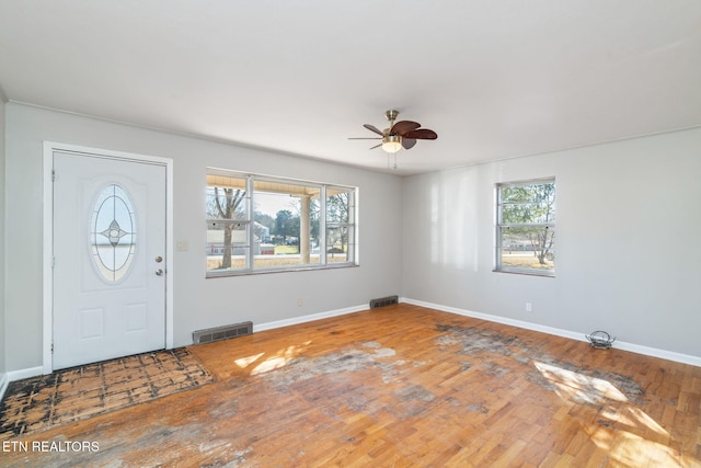 foyer entrance featuring hardwood / wood-style floors and ceiling fan