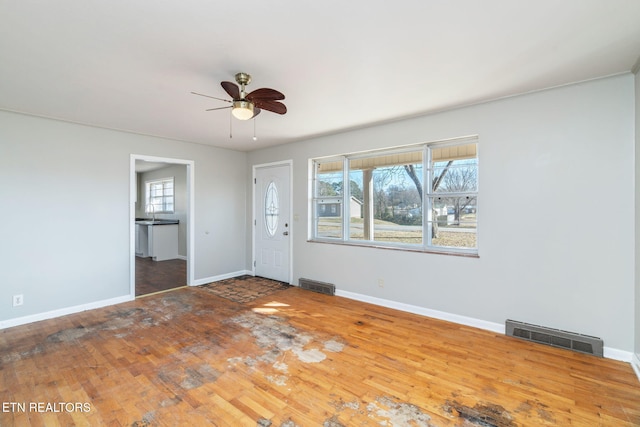 unfurnished room with hardwood / wood-style floors and ceiling fan