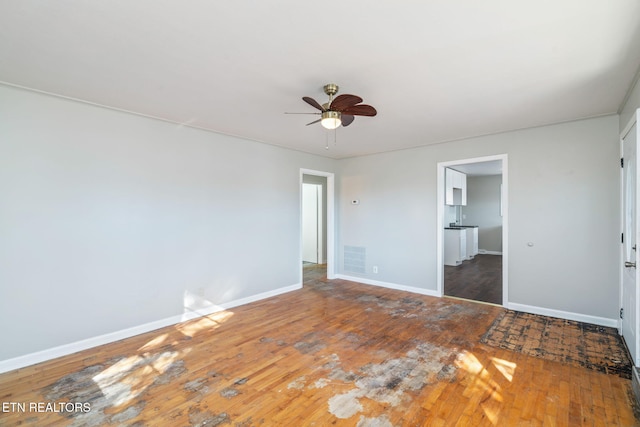 unfurnished bedroom featuring dark hardwood / wood-style flooring and ceiling fan