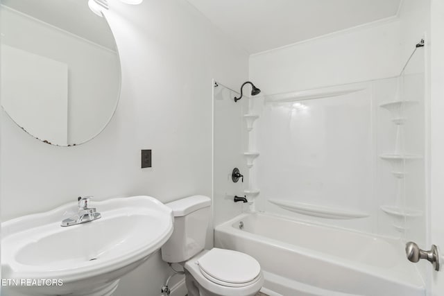 full bathroom with sink, bathtub / shower combination, and toilet